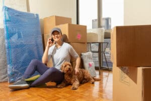 Young asian woman moving into her first metropolitan apartment.