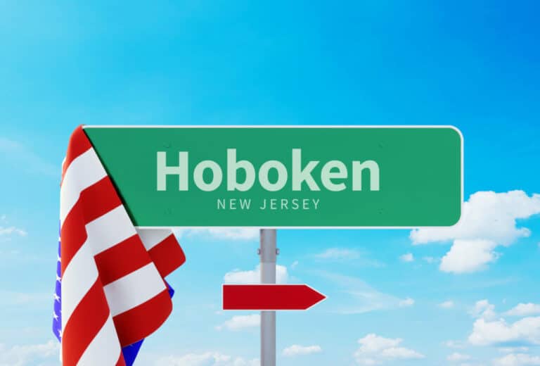 Hoboken – New Jersey. Road or Town Sign. Flag of the united states. Blue Sky. Red arrow shows the direction in the city. 3d rendering